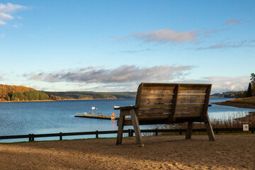 Obraz premium Giant bench by lake