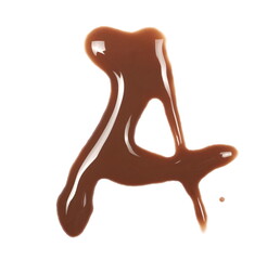 Spilled chocolate milk puddle in shape letter A isolated on white background, top view