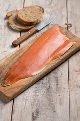 smoked trout over cutting board - 558992317