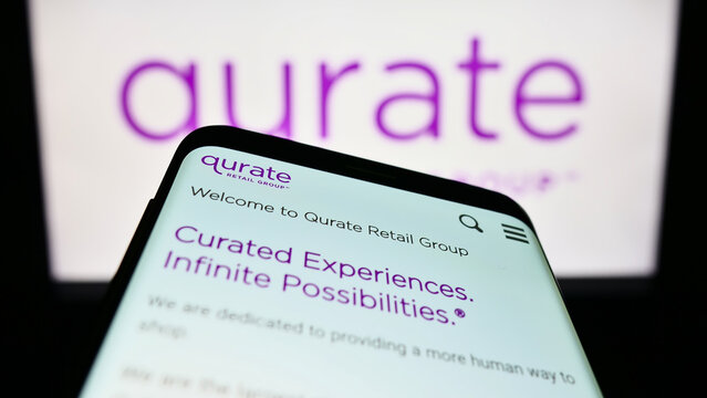 Stuttgart, Germany - 01-01-2023: Mobile phone with website of US media company Qurate Retail Inc. on screen in front of business logo. Focus on top-left of phone display.