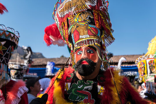 Chinelo or Chinelos are a traditional colorful costumed dancer in carnaval, is popular in the Mexican state of Morelos near Tepoztlan , State of Mexico and Mexico City, Milpa Alta and Xochimilco.