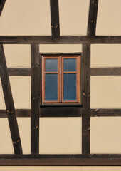 Vintage window frame on a half-timbered house facade in the old town of Herrieden in Germany