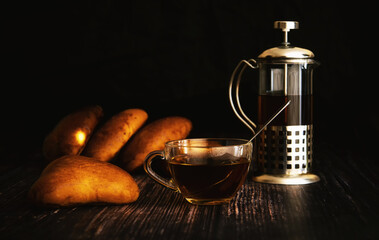 Pies with a cup of tea on the table.