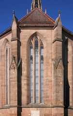 Pointed gothic window arch with tracery at the medieval monastery church in the old town of Heilsbronn in Franken region, Germany