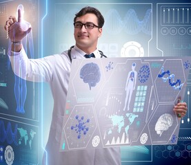 Young male doctor in futuristic medical concept