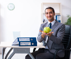 Young male accountant working in the office