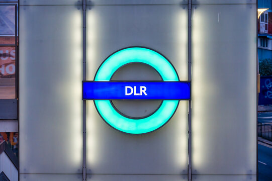 DLR roundel sign at a station at night
