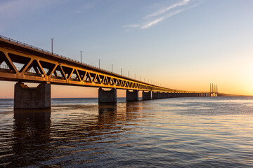 Naklejka na ściany i meble The Oresund Bridge at sunset. A bridge over to Denmark