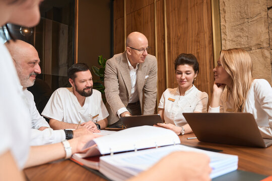 Symposium Of Doctors In Stylish Office Of Head Physician Of Clinic