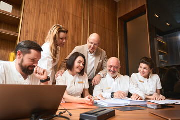 Team of employees of a medical clinic gathered for meeting