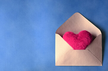 Envelope and pink hearts on blue background. Valentine's day, love, anniversary concept