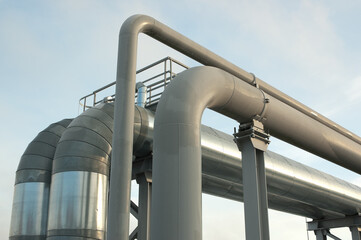 Naklejka premium pipeline close-up, in the photo pipeline blue sky and clouds, bottom view