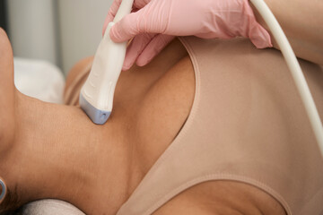 Young female having tests before starting treatment in clinic