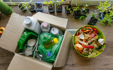 Top view of fruits and vegetable peelings and plastic waste