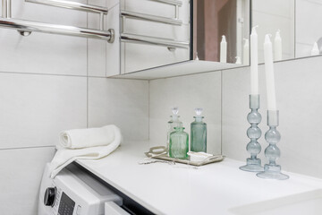 Decorative bottles as a decor for a bathroom in a light style