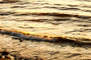 Waves crashing on the beach with artistic motion