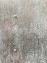 gray metal plate with rivets
