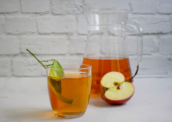 Fresh apple juice on a light background