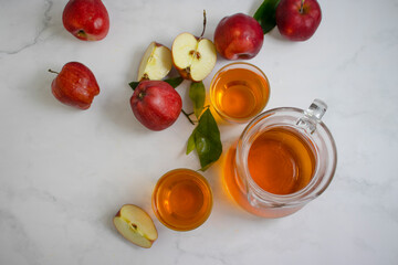 Fresh apple juice on a light background