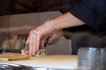 Chef preparing sushi in a restaurant