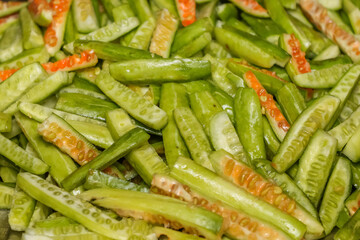 Close up view of cut slices of Ivy Gourd vegetables for cooking.