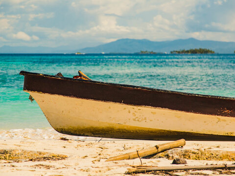 Wooden boat on land in San Blas islands.