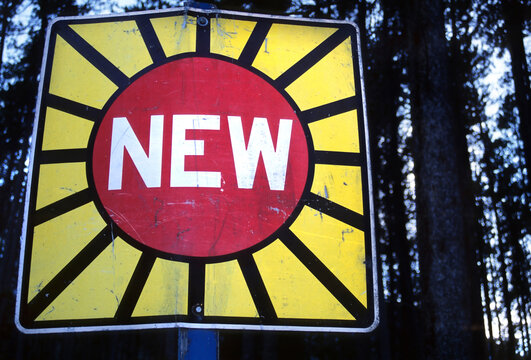 Sign in Banff Canada marking 'New'.