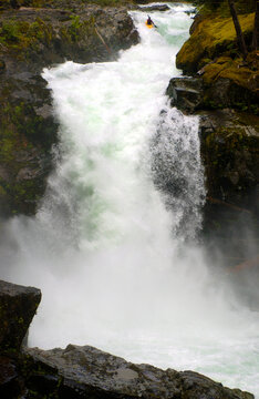 A kayaker drops into a waterfall.