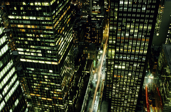 A View From Above And At Night Of Skyscrapers, New York City, New York.