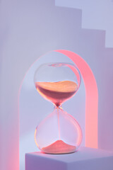 Hourglass on podium. Surreal arches in pink and purple neon lights. Hour glass is also known as sandglass, sand timer or sand clock.