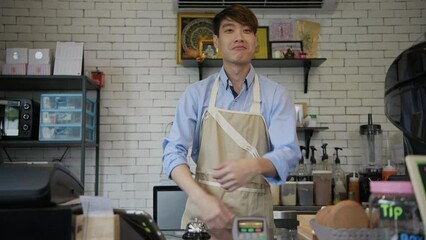 Barista concept of 4k Resolution. The owner is smiling with confidence in the coffee shop.
