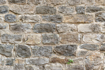 Architectural background texture of a medieval natural stone wall at the old castle Schaumburg, Germany