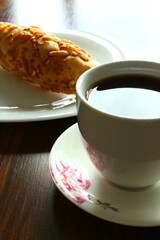 Brazilian breakfast. Coffee cup with bread.