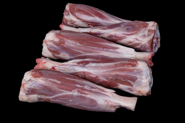 Fresh raw meat of lamb leg. Raw lamb leg isolated on black background. ossobuco (lamb shank steak...