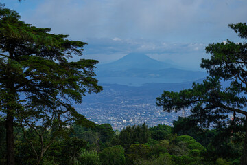 El Salvador city with a view between trees, a volcano and a lake in 2022 