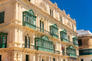 Obraz premium Valletta, Malta, 22 May 2022: Buildings with traditional maltese balconies in Valletta old town