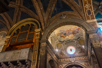 San Gimignano, Italy, 15 April  2022: Beautiful frescoes in the medieval cathedral