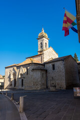 Fototapeta premium San Quirico d'Orcia, Italy, 16 April 2022: Medieval church of the historic center