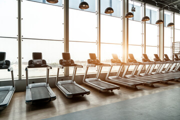 The treadmill in front of the fitness center floor -to -ceiling window