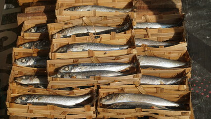 Pindang fish packed in a bamboo basket at a traditional market in Indonesia