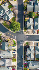 Aerial photos over a suburb in Oakley, California with homes, streets and parks with blue sky and room for text