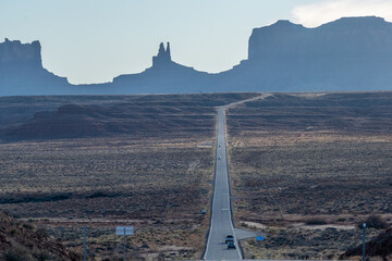 Monument Valley long road with cars in daytime, Highway 163, Utah, USA