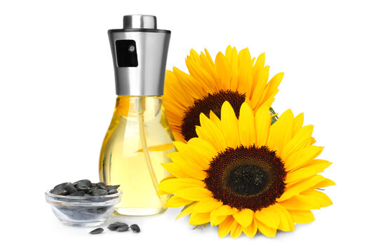 Spray Bottle With Cooking Oil, Sunflowers And Seeds On White Background