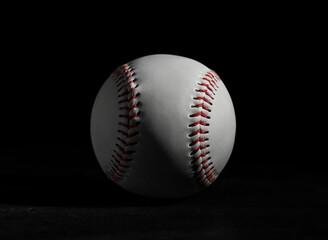 Baseball ball on black background, closeup. Sports game