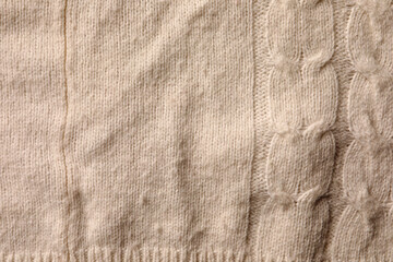 Knitted cloth with lint as background, top view. Before using of fabric shaver
