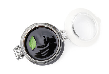 Glass jar with balsamic glaze isolated on white, top view