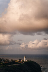 Kilauea Point Lighthouse glowing in the summer sun against a blue sky and ocean, Kauai, Hawaii, USA