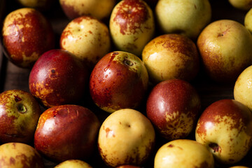 Chinese jujube or winter jujube on wooden table