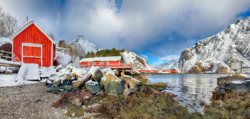 Amazing morning seascape of Norwegian sea and cityscape of Nusfjord village.