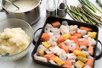 making a seafood pie
